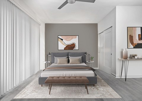 a bedroom with a bed and a ceiling fan  at SLX Atlanta, Georgia